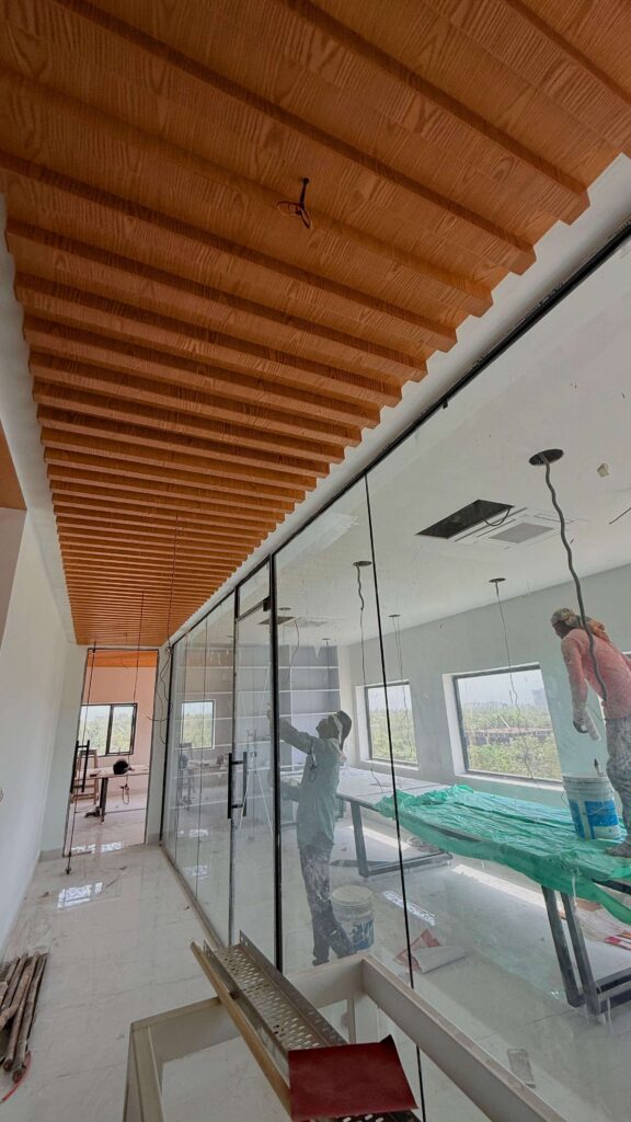 Commercial lab corridor with glass partitions and service planning