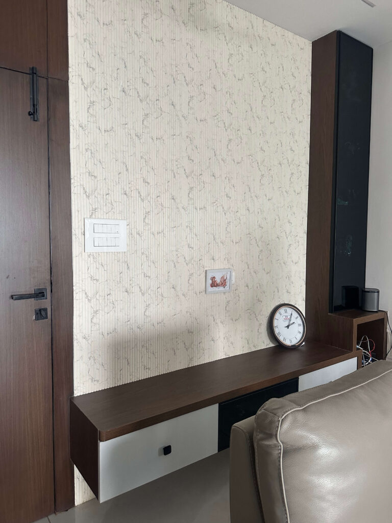 Villa room detail with console table, wallpaper and storage by IWY Designs