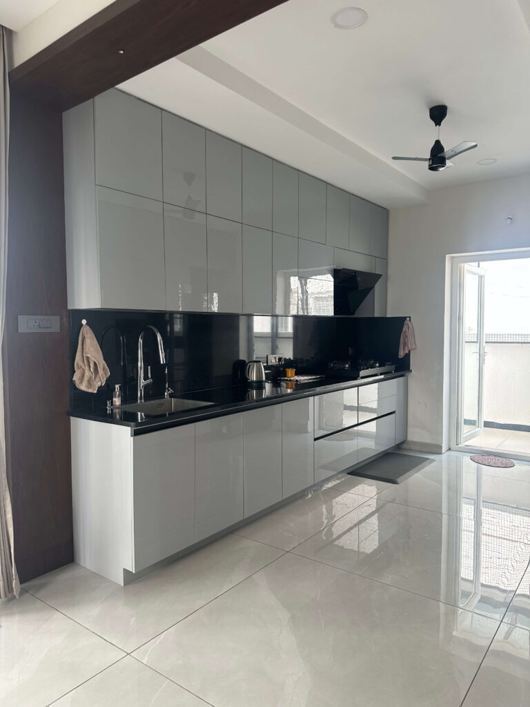 White and grey modular kitchen designed for May Fair Villa by IWY Designs