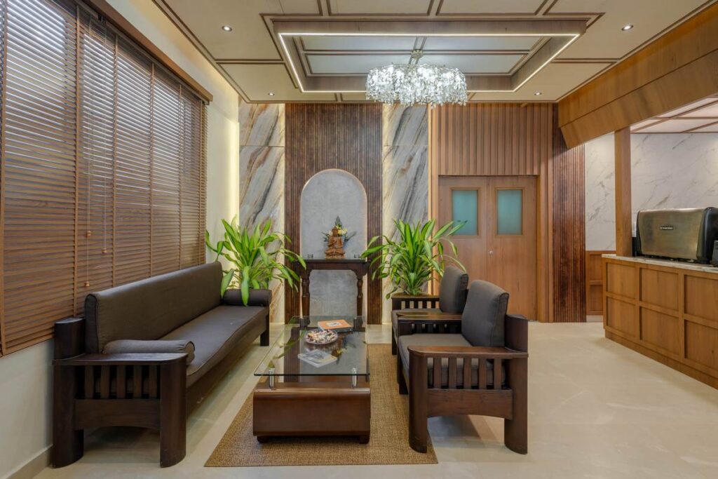 OneTen cafe enclosed dining lounge with wood finishes and layered lighting by IWY Designs Hyderabad