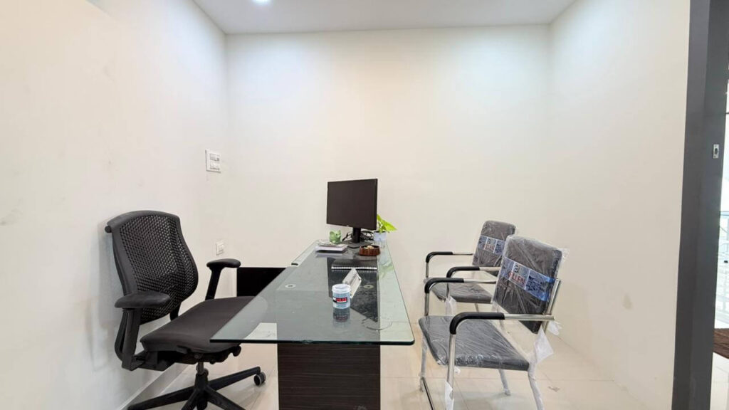 Doctor cabin with consultation desk and visitor seating by IWY Designs