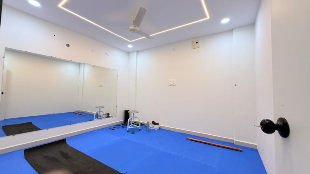 Physiotherapy treatment room with open functional layout by IWY Designs