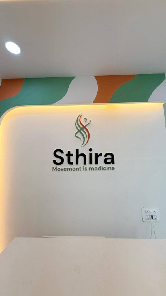 Clinic reception brand wall with custom colour accent by IWY Designs