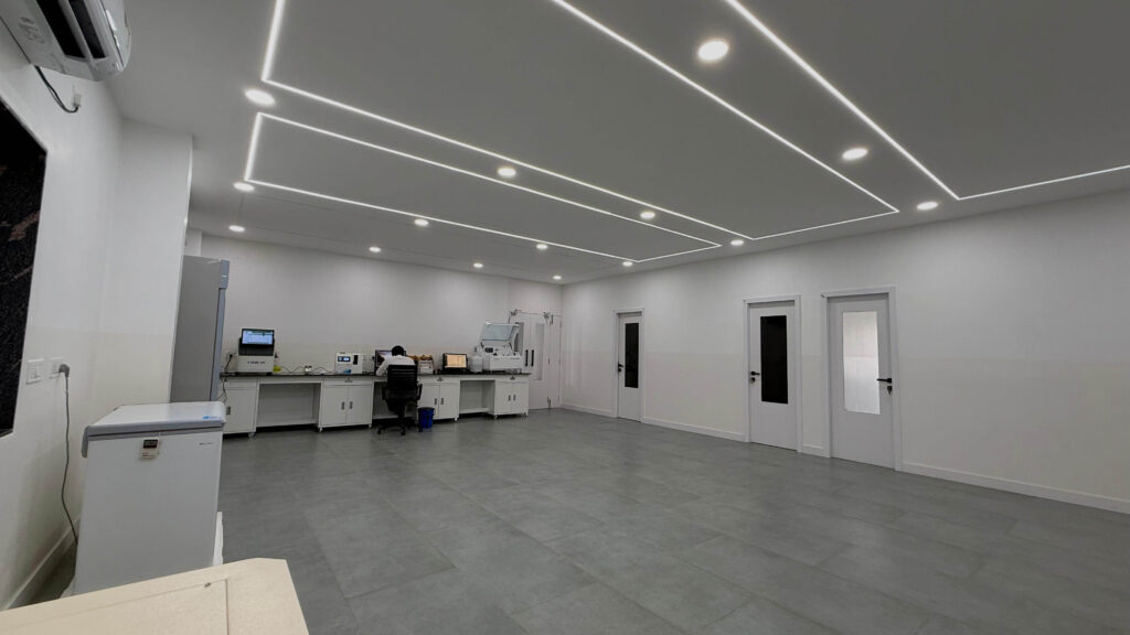 Diagnostics lab workspace with linear lighting and functional planning