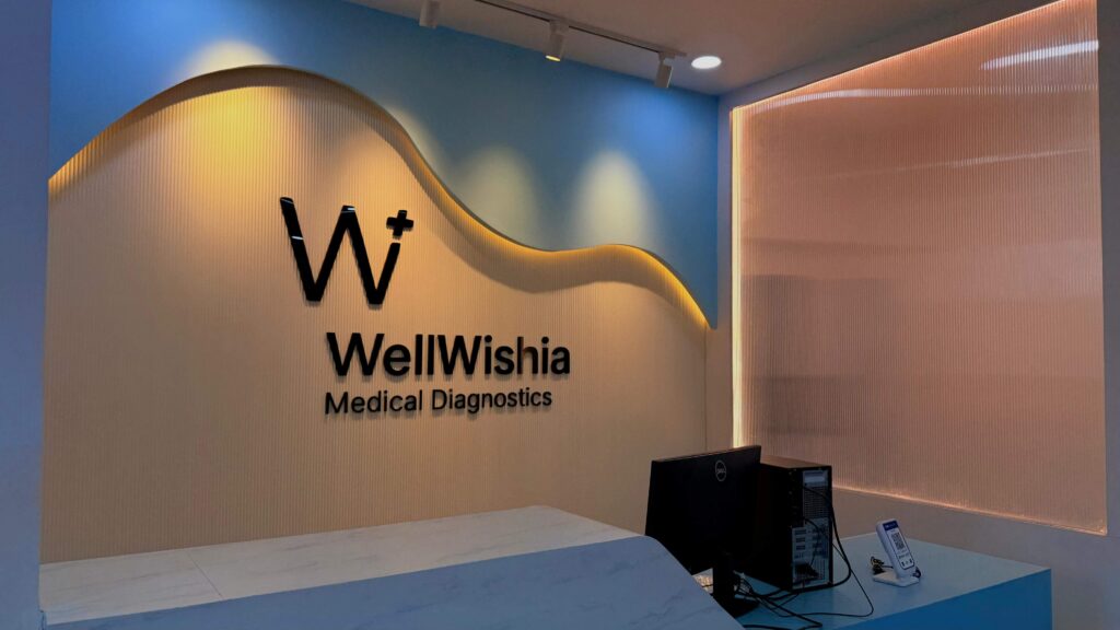WellWishia diagnostics reception brand wall designed by IWY Designs Hyderabad