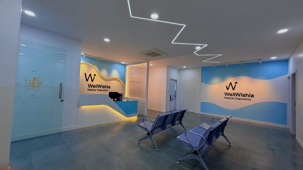 Diagnostics centre lobby with blue branding and patient seating by IWY Designs